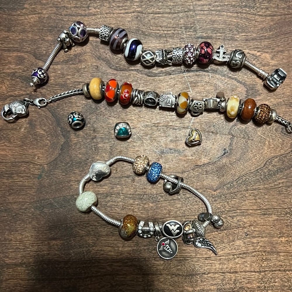 2 Pandora bracelets and 1 other unknown brand  with over 40 charms/dividers.